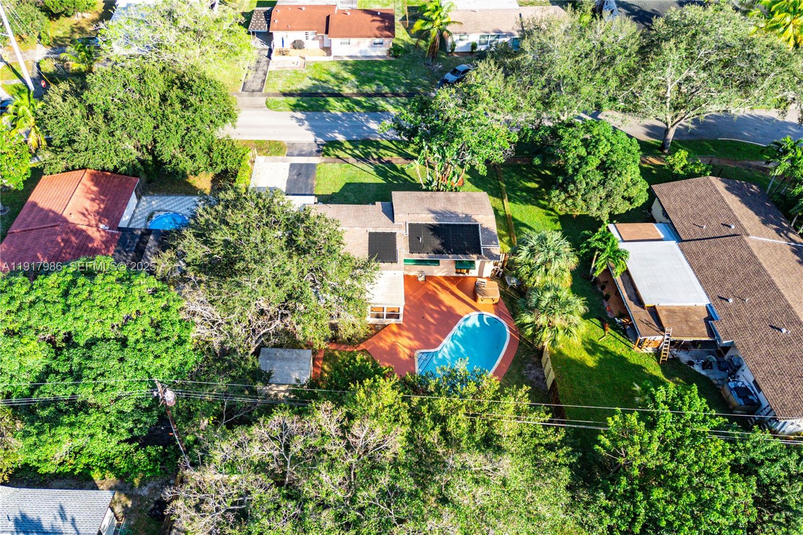 475 Northwest 46th Terrace Plantation, FL 33317 - Photo 42 of 43 an aerial view of a house with a yard and swimming pool