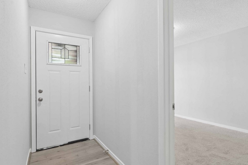 7403 Strawbridge Lane Houston, TX 77040 - Photo 3 of 22 a view of a hallway with a white walls