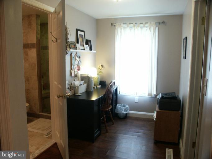61 Yew Road Baltimore, MD 21221 - Photo 1 of 30 a room with wooden floor and furniture