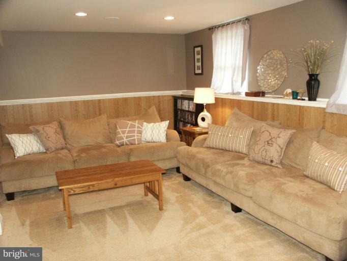 61 Yew Road Baltimore, MD 21221 - Photo 2 of 30 a living room with furniture and a large window