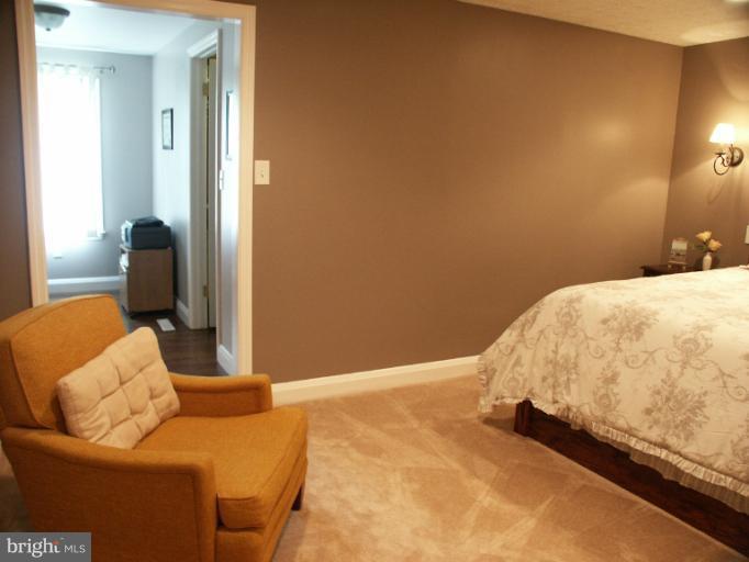 61 Yew Road Baltimore, MD 21221 - Photo 19 of 30 a bedroom with a bed and a couch