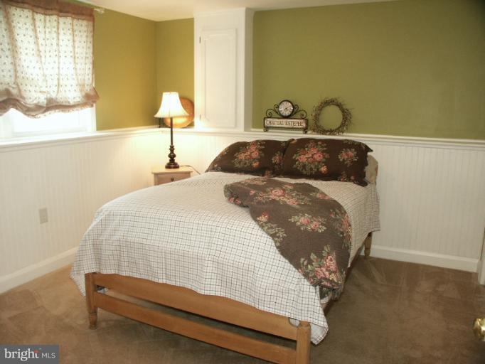 61 Yew Road Baltimore, MD 21221 - Photo 24 of 30 a bedroom with a bed and window