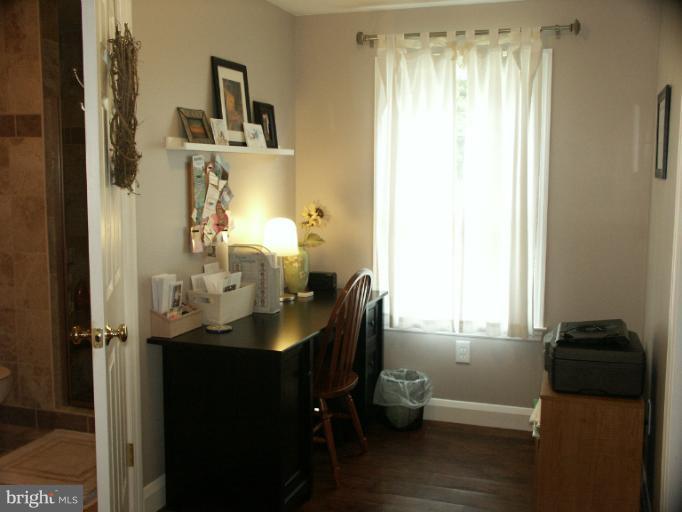 61 Yew Road Baltimore, MD 21221 - Photo 26 of 30 a bathroom with a sink and a mirror