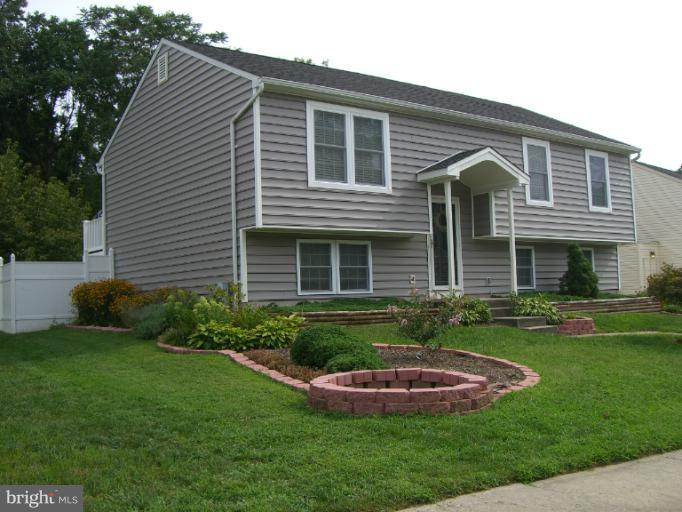 61 Yew Road Baltimore, MD 21221 - Photo 29 of 30 a front view of a house with garden and porch