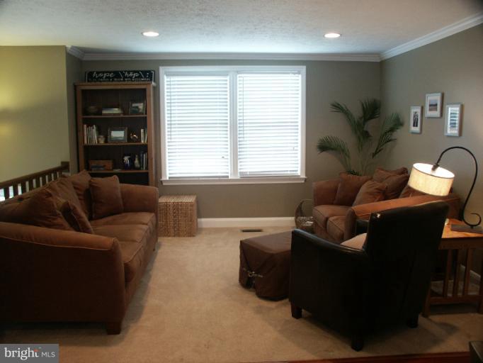 61 Yew Road Baltimore, MD 21221 - Photo 7 of 30 a living room with furniture and a window