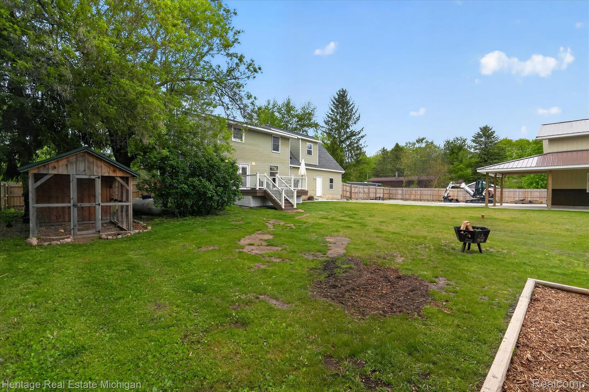 5835 Warner Road Fowlerville, MI 48836 - Photo 41 of 59 Fenced backyard with an outbuilding and a deck