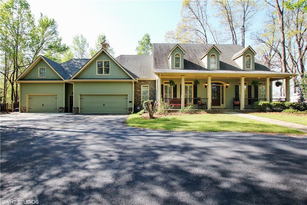 14090 Providence Road Milton, GA 30004 - Photo 1 of 1 Front view of house from circular driveway. Note stone accents. Gracious front porch w stone porch floor. Plenty of parking for guests.