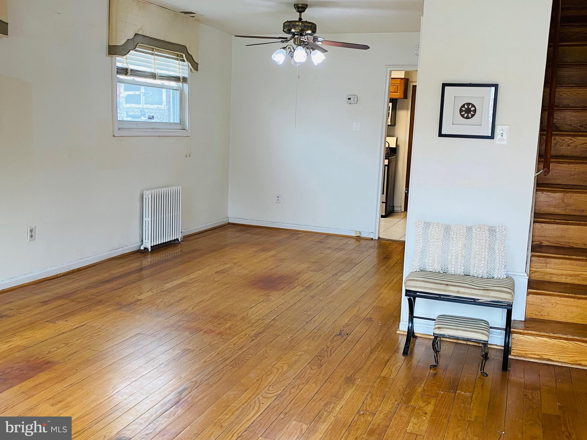 7527 8th Street Northwest Washington, DC 20012 - Photo 3 of 18 an empty room with wooden floor and windows