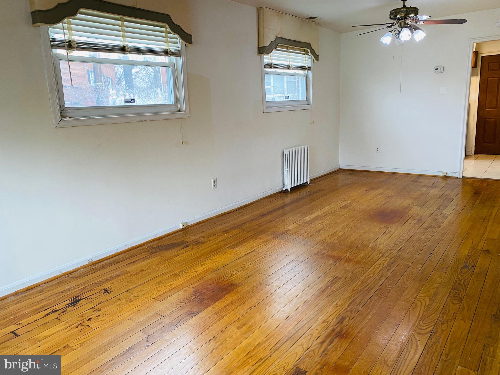 7527 8th Street Northwest Washington, DC 20012 - Photo 4 of 18 a view of empty room with wooden floor and fan