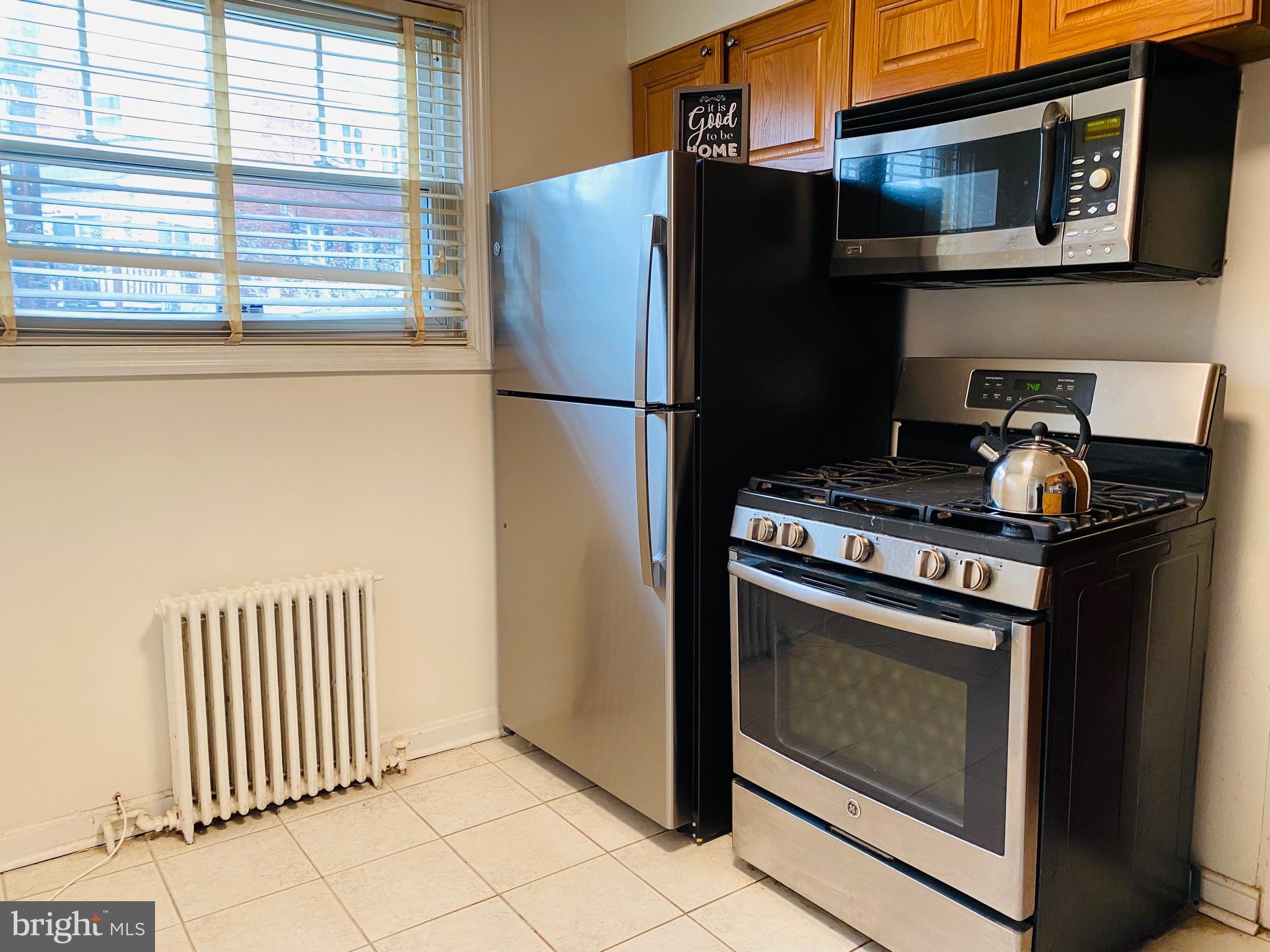 7527 8th Street Northwest Washington, DC 20012 - Photo 9 of 18 a kitchen with stainless steel appliances granite countertop a refrigerator and a stove