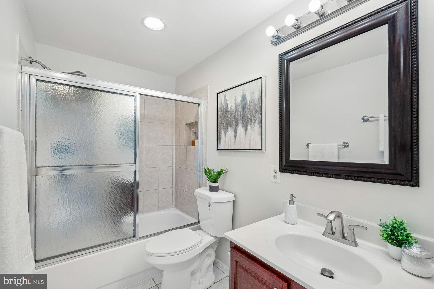 1652 Kramer Street Northeast Washington, DC 20002 - Photo 17 of 26 a bathroom with a sink toilet and shower