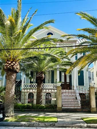 a front view of a residential apartment building with a yard