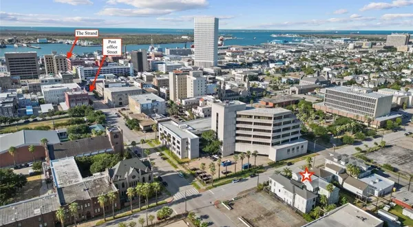 a bathroom with a sink a toilet and shower curtain