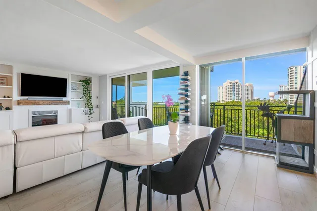 a view of a dining room with furniture window and outside view