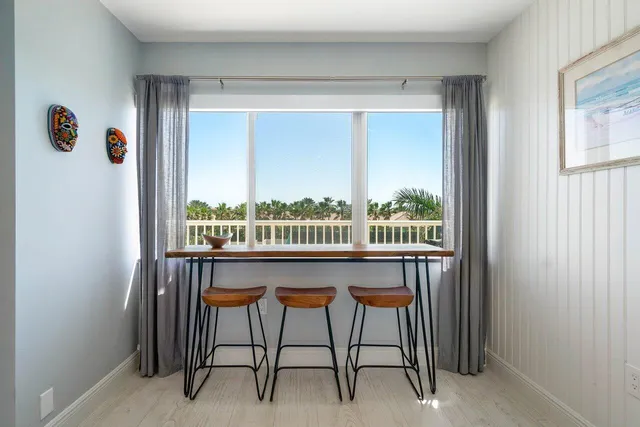 a view of a balcony and furniture