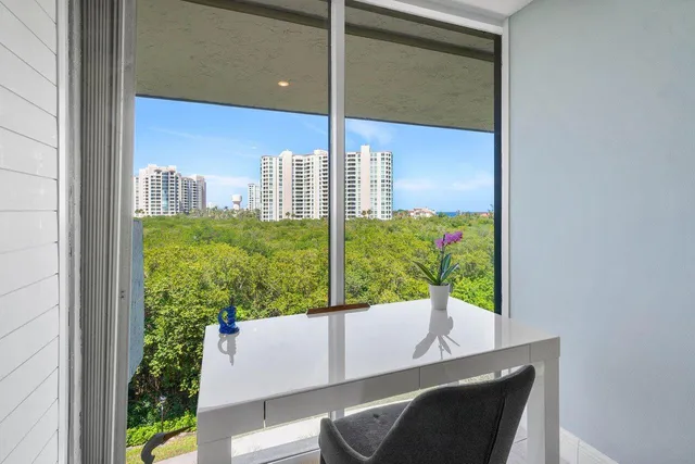 a view of potted plants next to a building