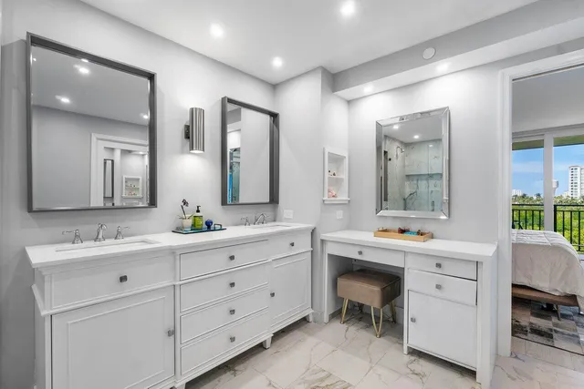 a spacious bathroom with a double vanity sink double and mirror