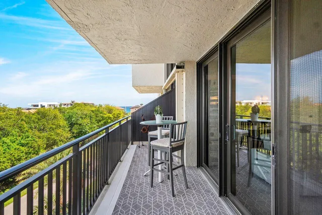 a view of balcony with furniture