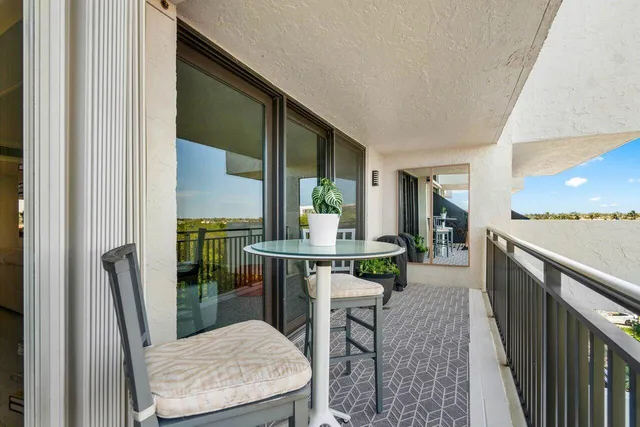 a dining room with furniture window and wooden floor