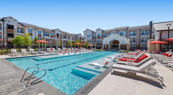 a view of multiple houses with a patio