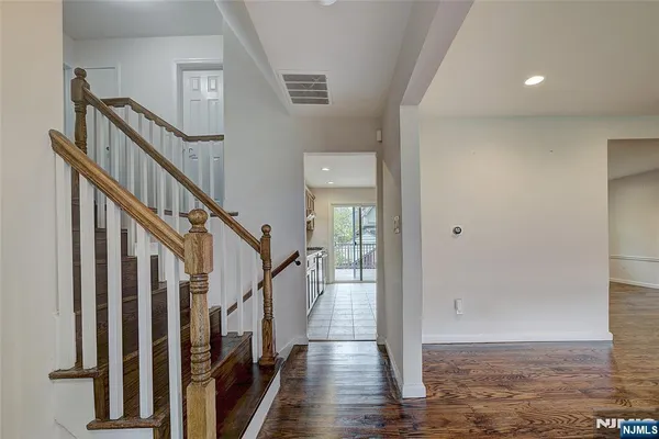a view of an entryway with wooden floor