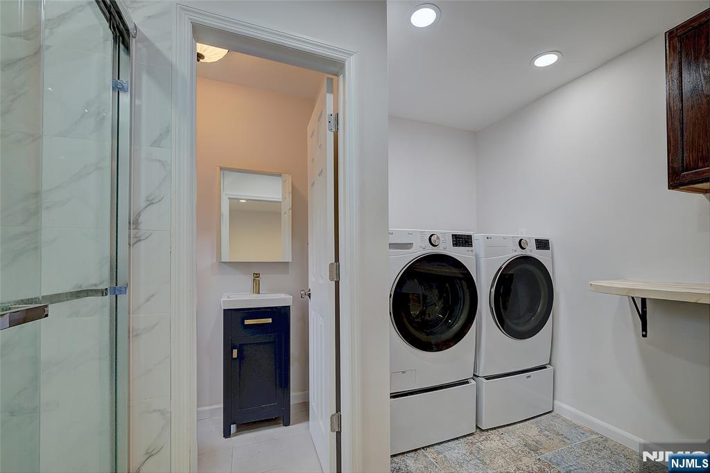 819 Ridgewood Road Millburn, NJ 07041 - Photo 32 of 39 a utility room with sink dryer and washer