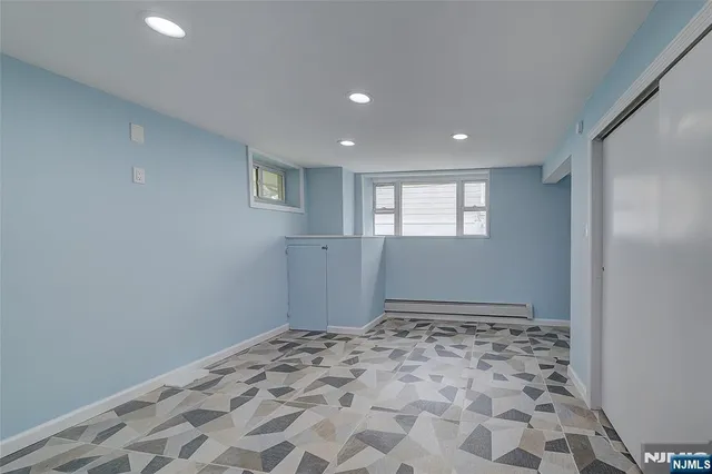 a bathroom with a glass door shower