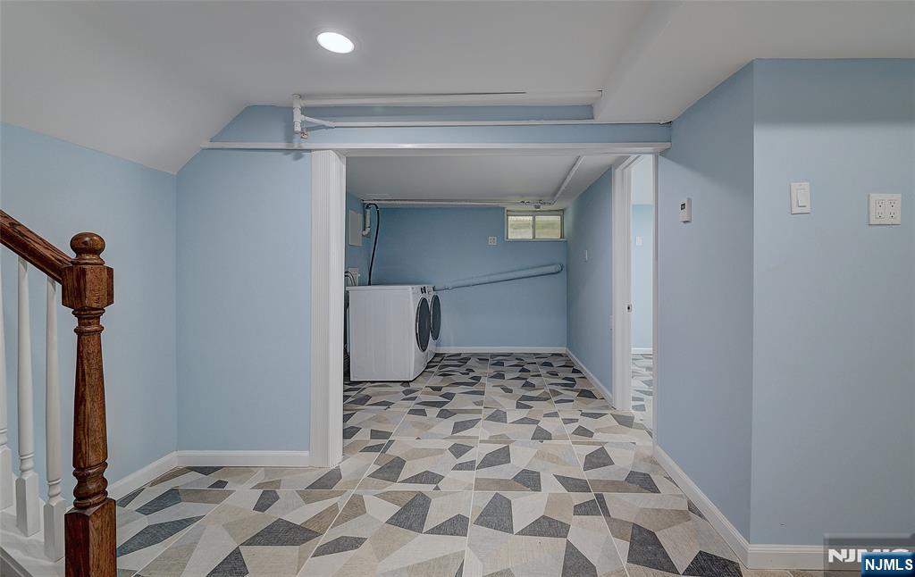 819 Ridgewood Road Millburn, NJ 07041 - Photo 34 of 39 a bathroom with a glass door shower