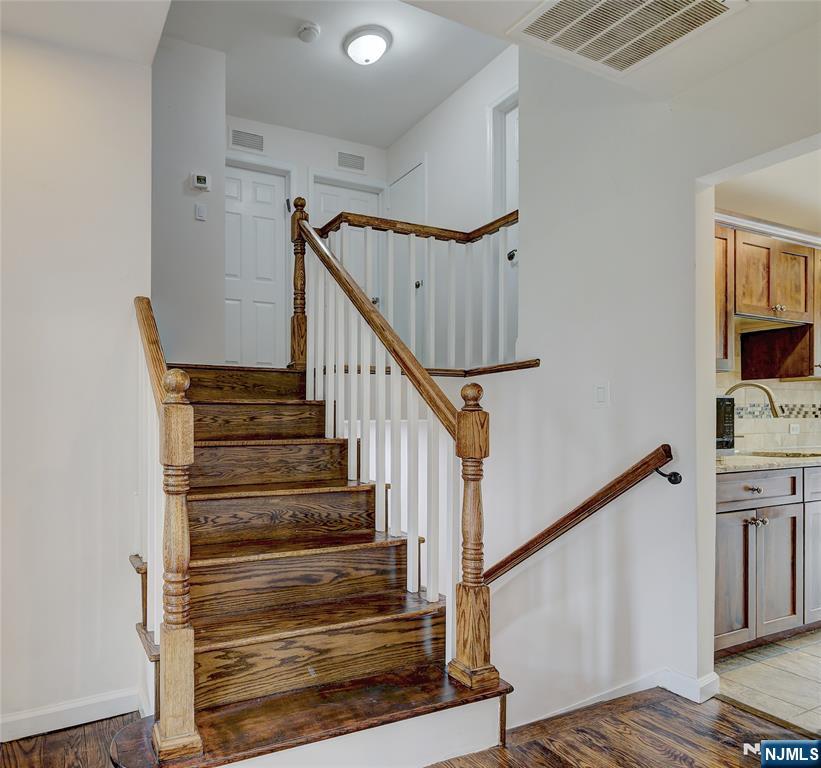 819 Ridgewood Road Millburn, NJ 07041 - Photo 4 of 39 a view of entryway and hall with wooden floor