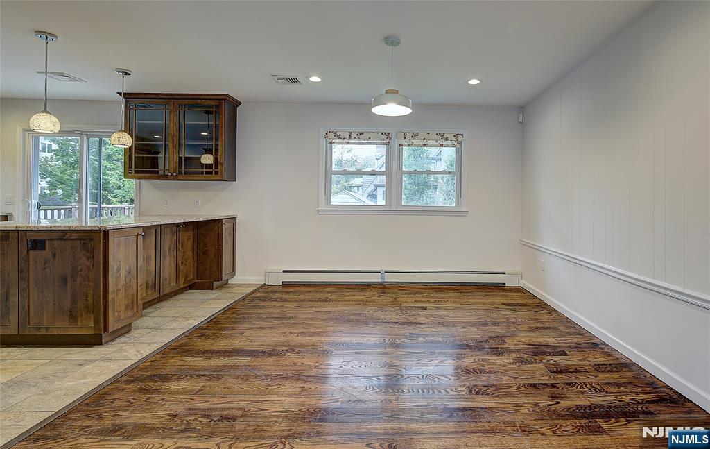 819 Ridgewood Road Millburn, NJ 07041 - Photo 8 of 39 an empty room with wooden floor and windows