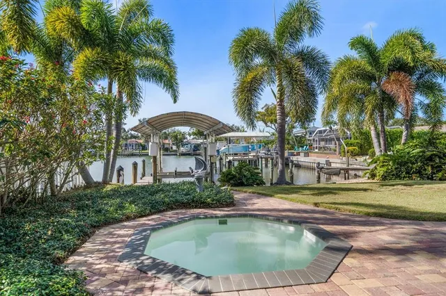 an aerial view of a house with a lake view