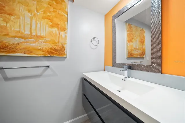 a bathroom with a toilet sink and shower