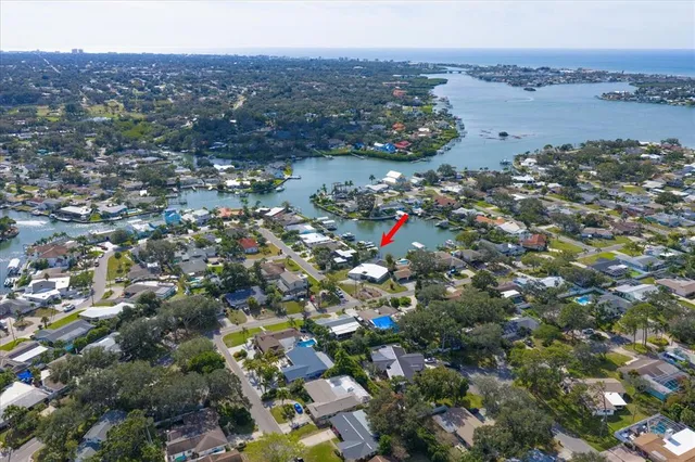 a bathroom with a granite countertop sink vanity and mirror