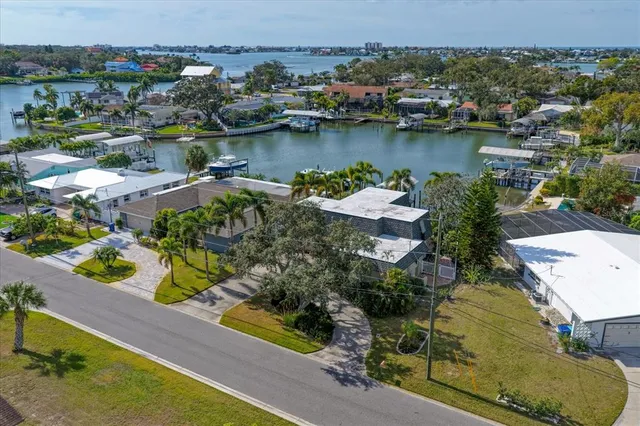 a large kitchen with a large window and stainless steel appliances