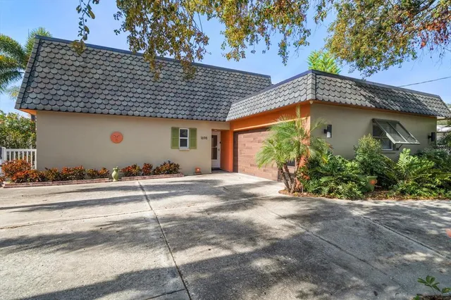 a kitchen with stainless steel appliances a refrigerator and a stove top oven