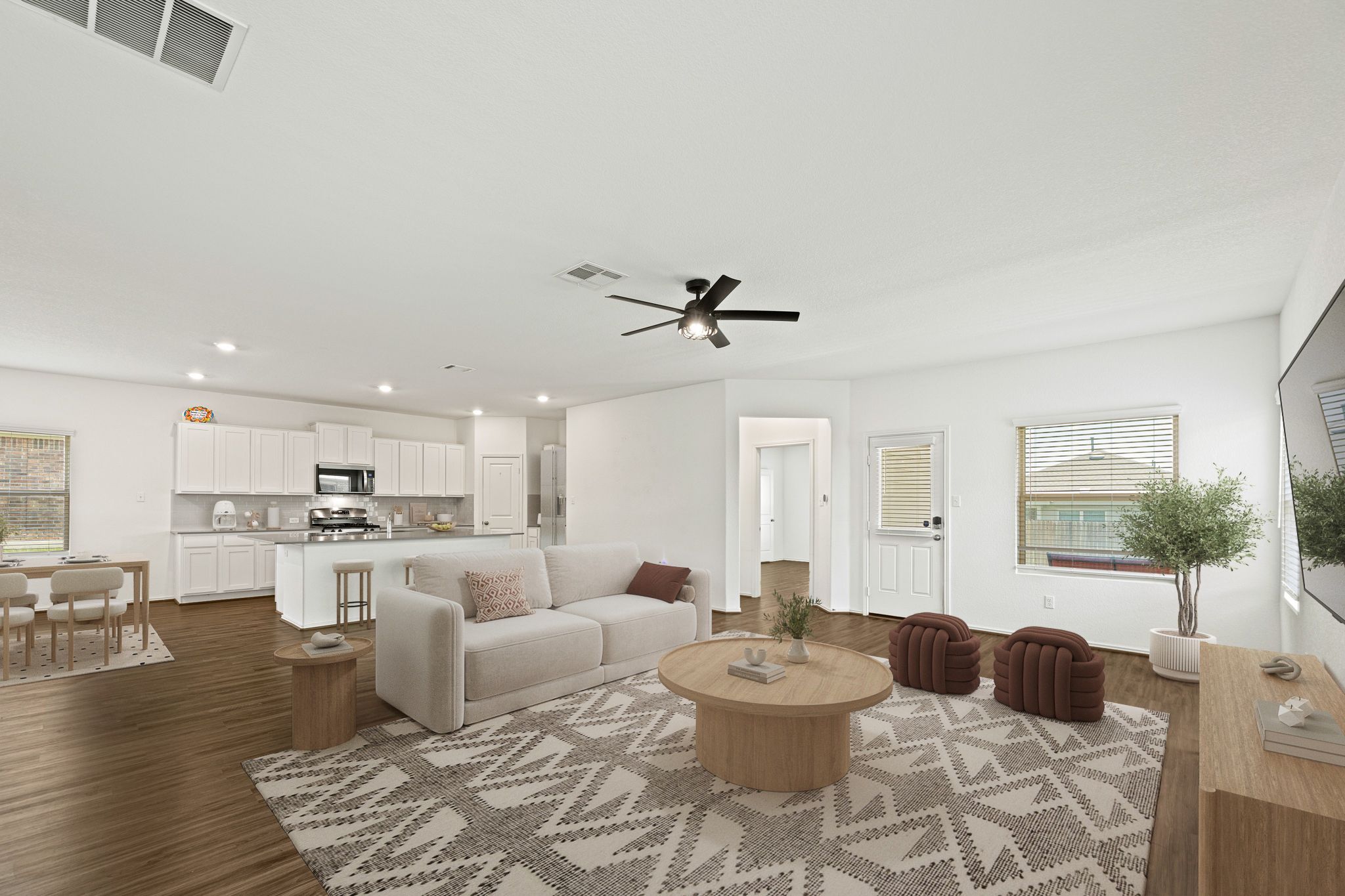 21317 Resource Road Pflugerville, TX 78660 - Photo 1 of 37 An open-concept layout unites the naturally illuminated living room and kitchen, creating an inviting flow.