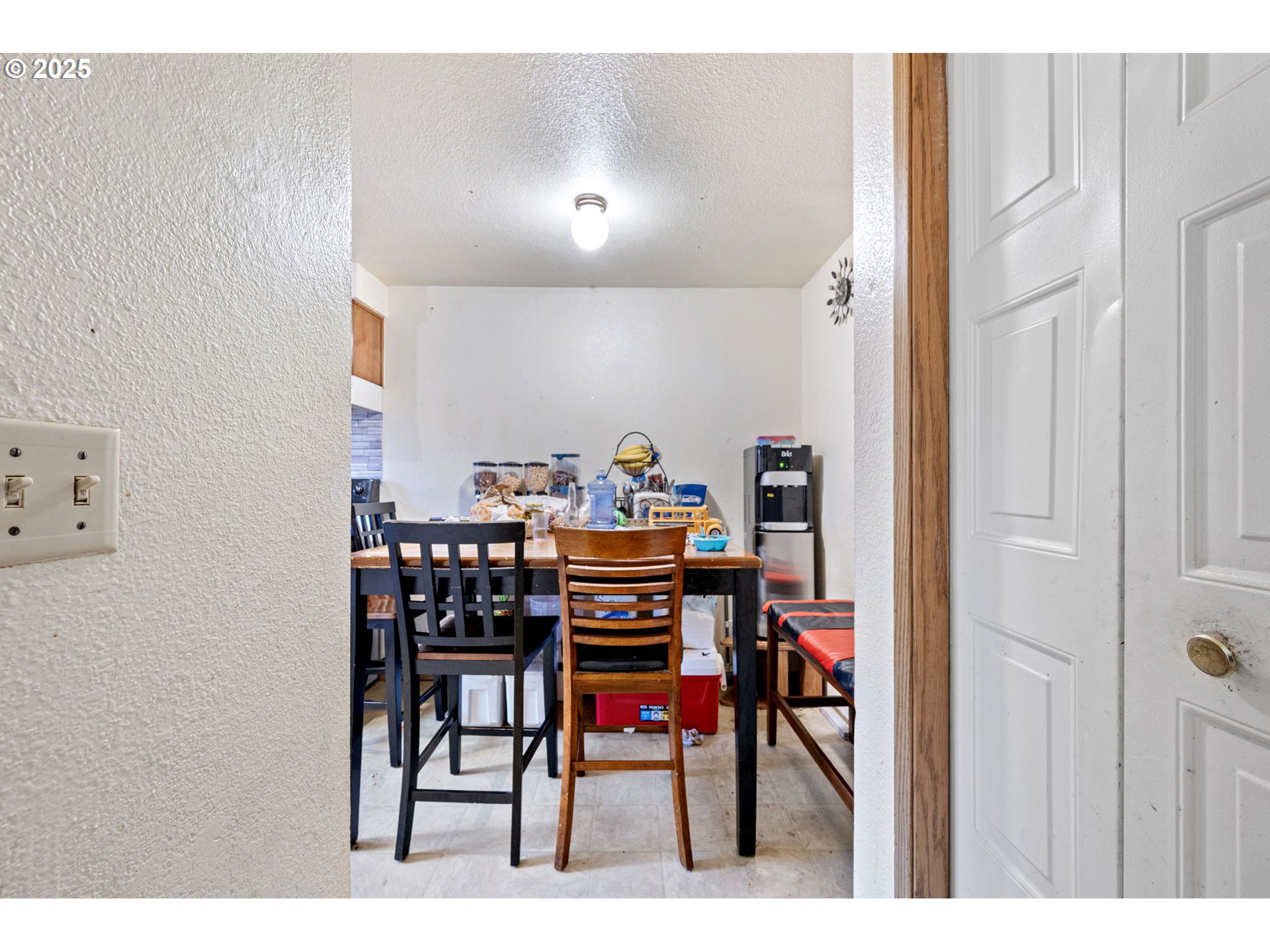1194 R Street Springfield, OR 97477 - Photo 3 of 22 a view of a dining room with furniture and a rug