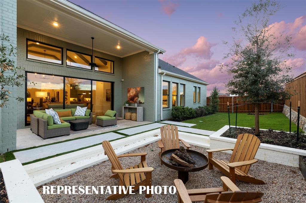 2117 Wakefield Lane Allen, TX 75013 - Photo 8 of 12 a view of a patio with couches table and chairs with wooden fence and plants