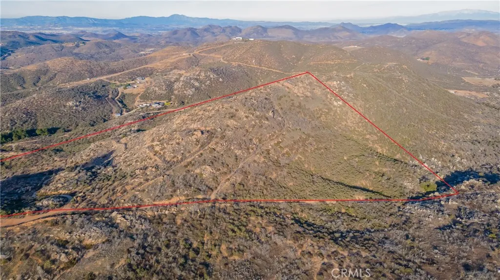 0 Lawghlin Temecula, CA 92592 - Photo 1 of 19 a view of a dry yard with mountains in the background