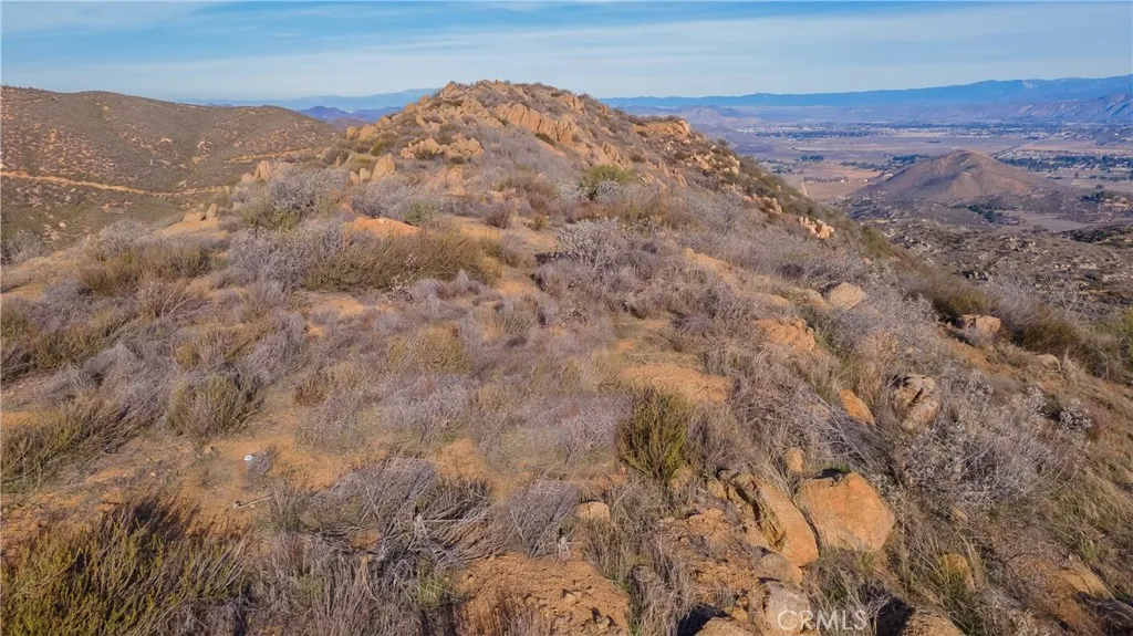 0 Lawghlin Temecula, CA 92592 - Photo 17 of 19 a view of a dry yard with mountains in the background