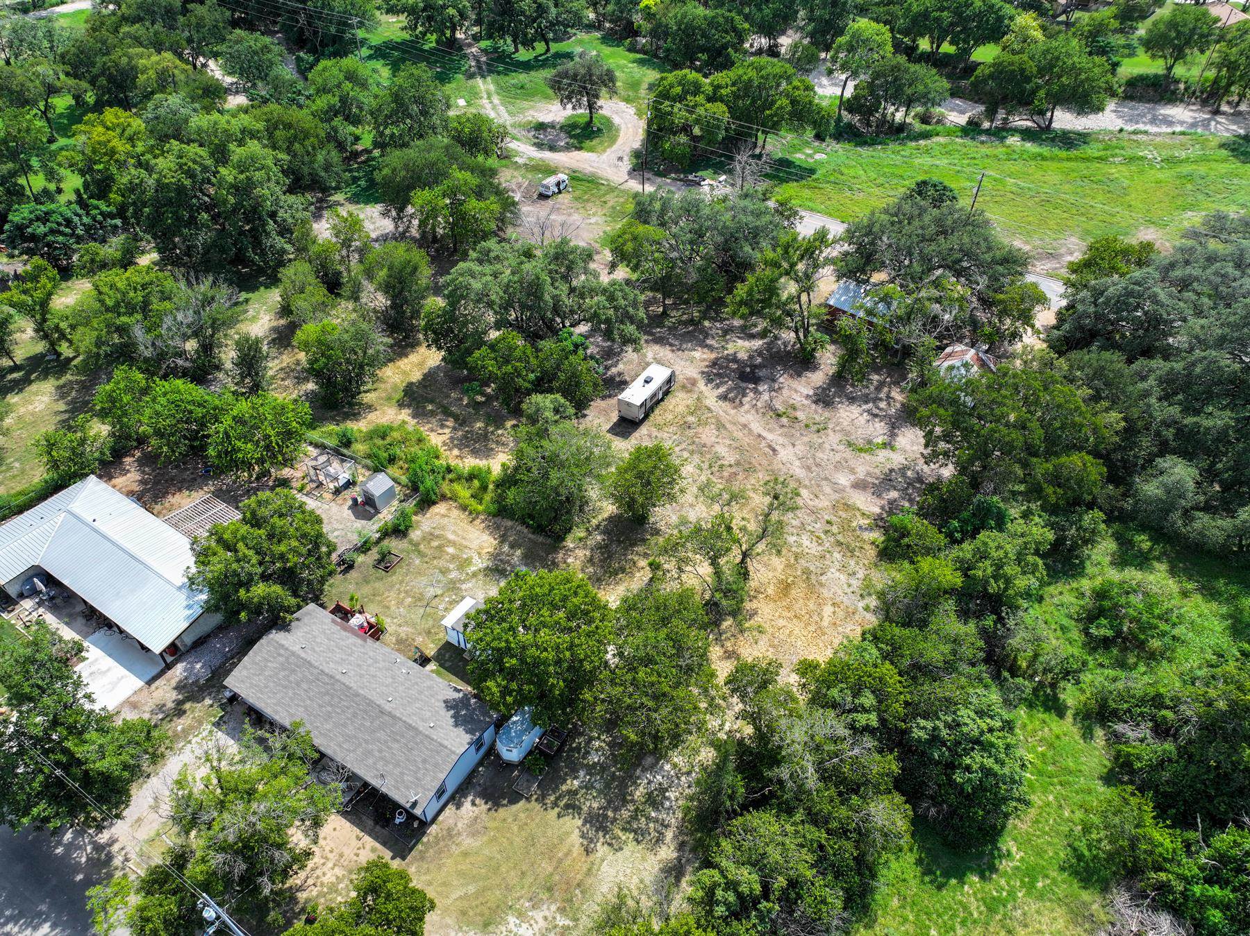 Tbd South Pierce Street Burnet, TX 78611 - Photo 8 of 19 an aerial view of residential house with outdoor space and trees all around