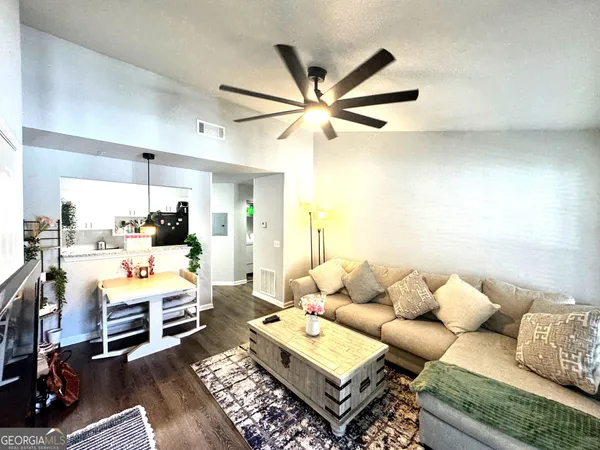 a living room with furniture and a rug