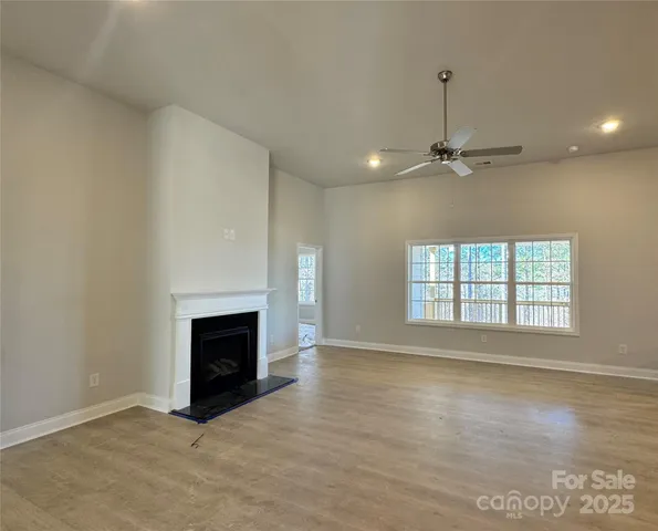 a view of a livingroom with wooden floor and closet