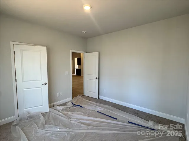 a view of wooden floor and windows in a room