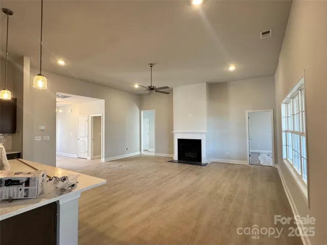 a kitchen with kitchen island a sink stainless steel appliances and cabinets