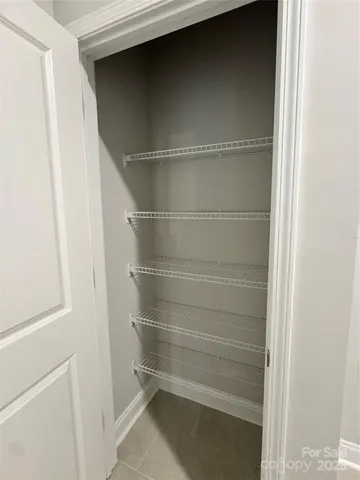 a view of a balcony with wooden floor