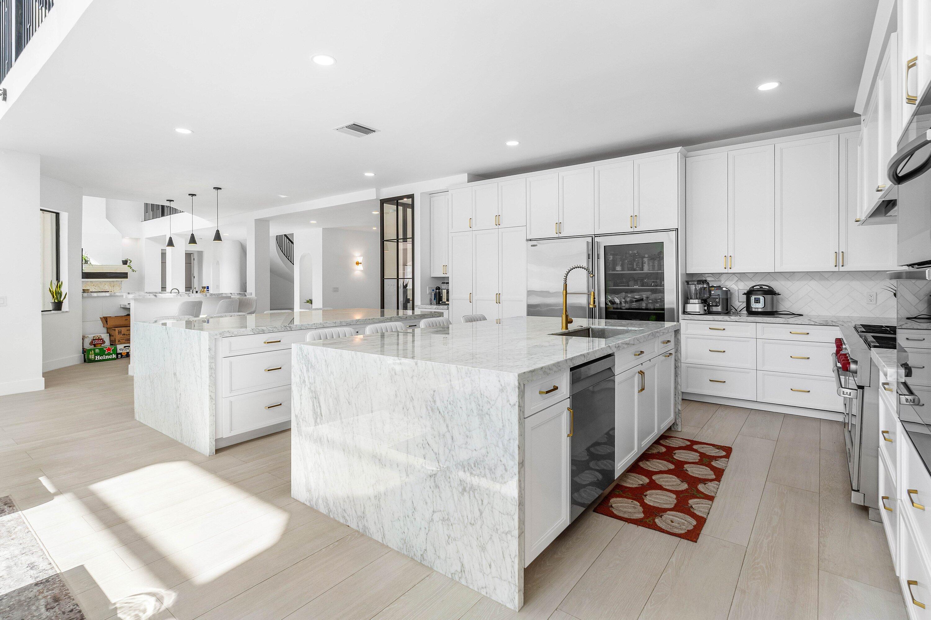 17600 Fieldbrook Circle East Boca Raton, FL 33496 - Photo 21 of 91 a kitchen with stainless steel appliances kitchen island granite countertop a sink and cabinets