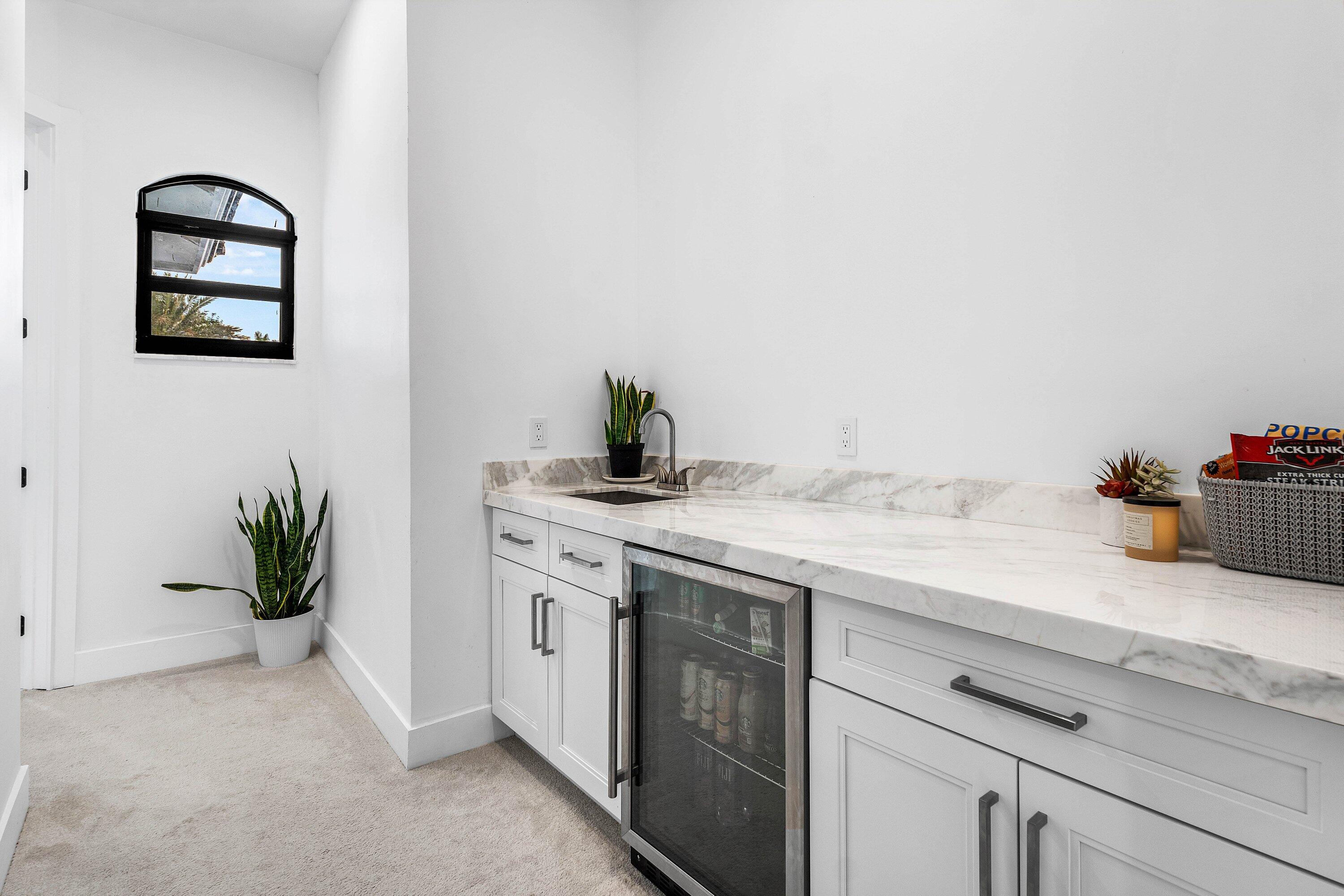 17600 Fieldbrook Circle East Boca Raton, FL 33496 - Photo 39 of 91 a kitchen with a granite countertop white cabinets and a stove