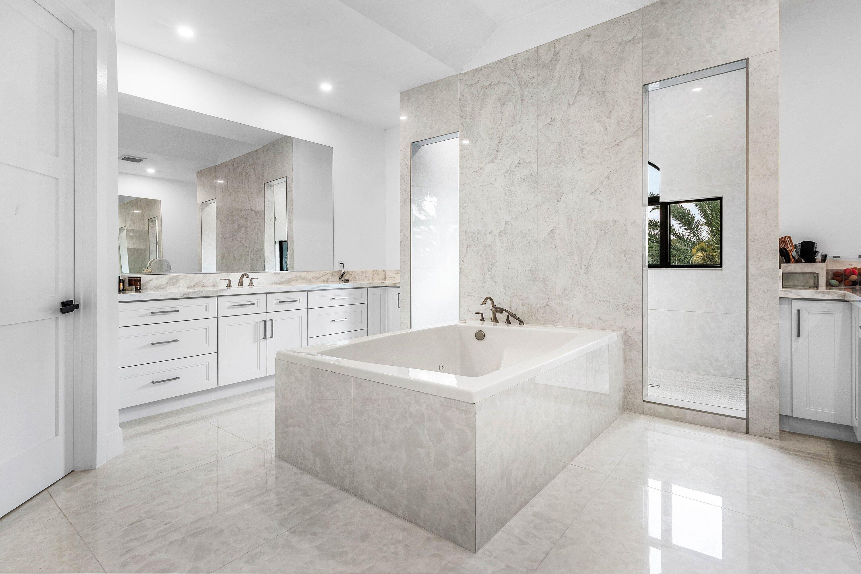 17600 Fieldbrook Circle East Boca Raton, FL 33496 - Photo 40 of 91 a large bathroom with a double vanity sink mirror and bathtub