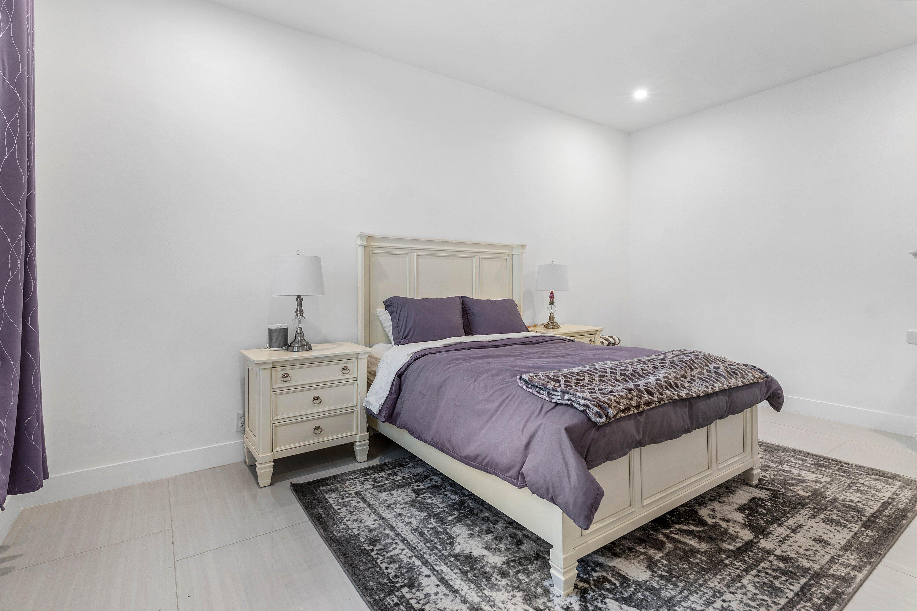 17600 Fieldbrook Circle East Boca Raton, FL 33496 - Photo 54 of 91 a bedroom with a bed and window